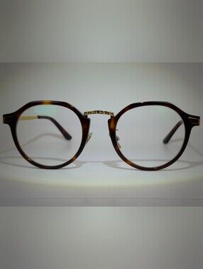 Yates. Tortoiseshell Round Glasses with Gold Metal. Decor.